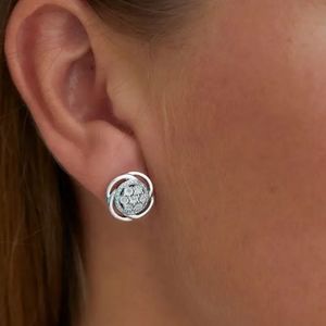 Sterling Silver Bright Cut Diamond Swirl Stud Earrings - 0.10 ctw